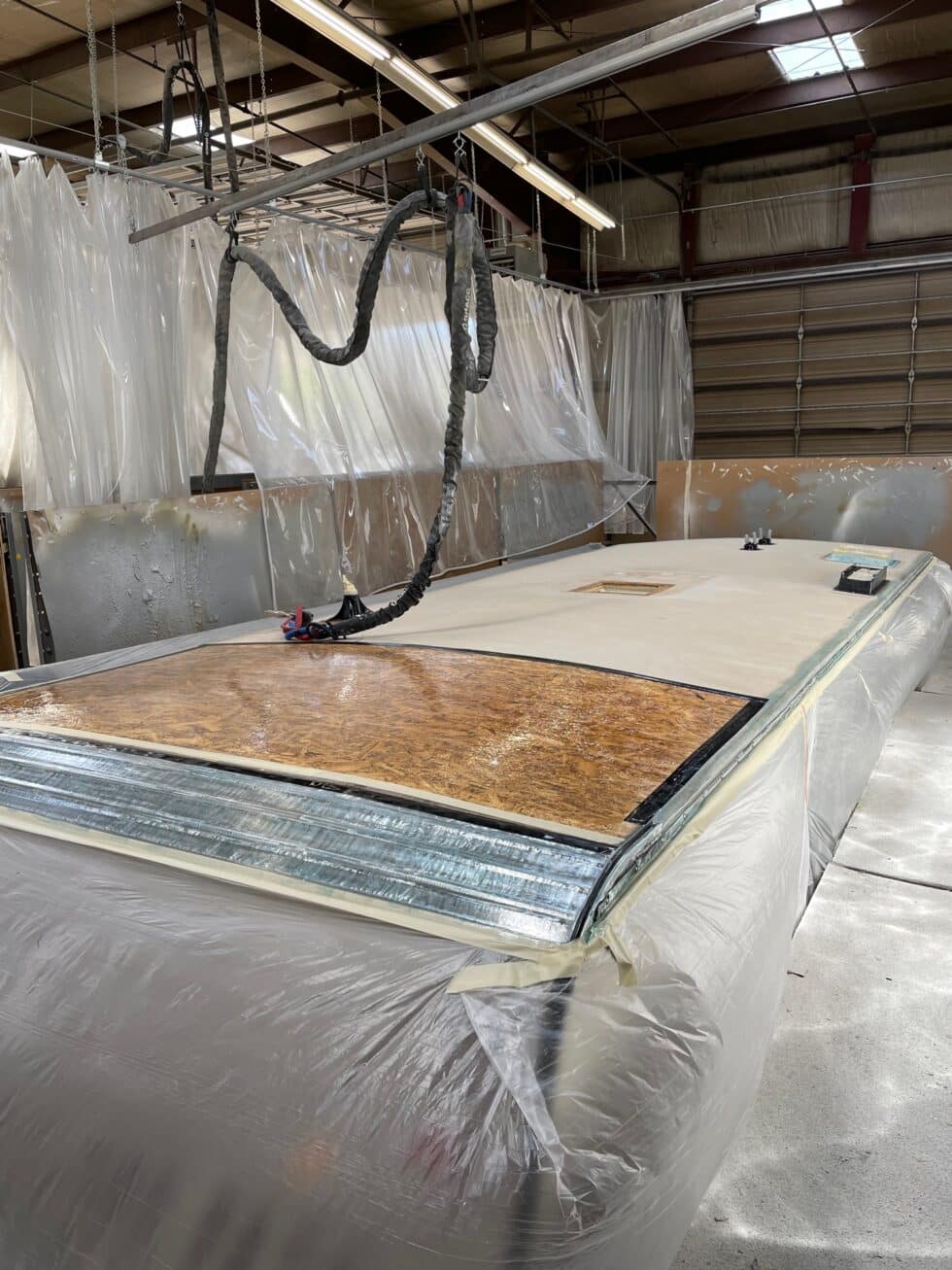 KZ Sportsman Bumper pull RV having its roof repaired