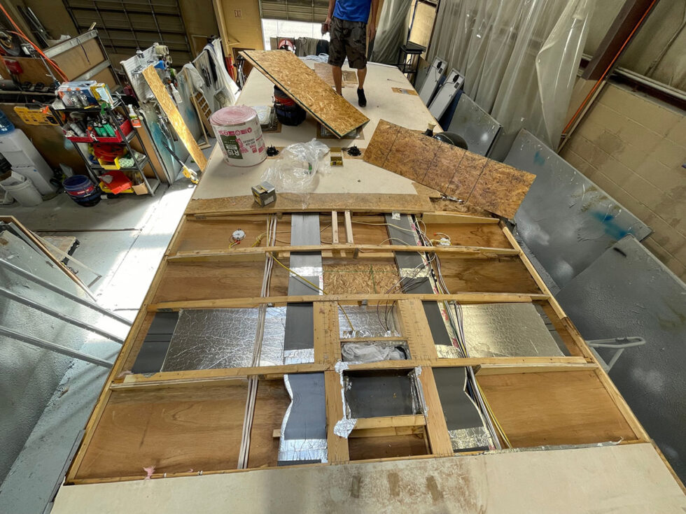 damaged rv roof being repaired