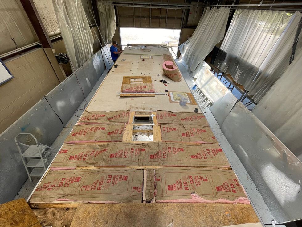 damaged rv roof being repaired