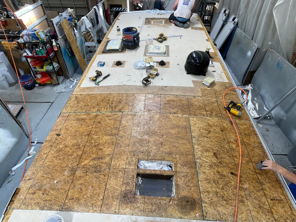 damaged rv roof being repaired