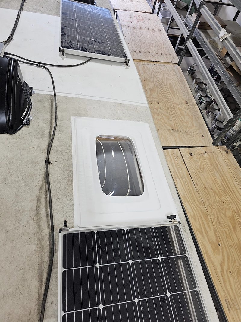 Skylight and solar panels on a Patched FlexArmor RV roof